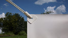 BANNERUPS Adhesive Banner Tabs used to hang banner. Photo courtesy of Banner Ups.