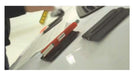 The Black Magnet Squeegee on hood of car holding knife and vinyl.  