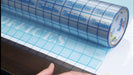 TransferRite Medium Tack 1310 Ultra Clear with Grid. Photo courtesy of American Biltrite. 