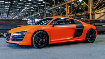 Audi R8 Wrapped in 3M Satin Neon Fluorescent Orange.  Photo courtesy of Lettering Express, OKC, OK.