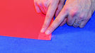 Edge Tabs Adhesive Grommet Tabs being applied to banner. Photo courtesy of Banner Ups.